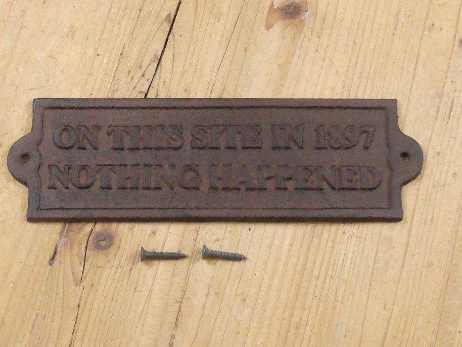 "ON THIS SITE IN 1897 NOTHING HAPPENED" CAST IRON SIGN