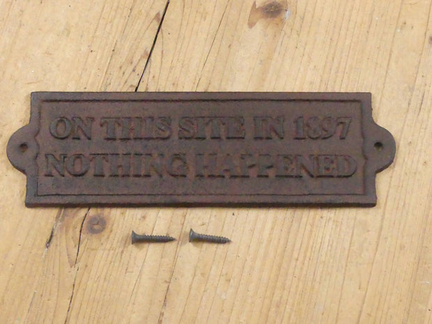 "ON THIS SITE IN 1897 NOTHING HAPPENED" CAST IRON SIGN