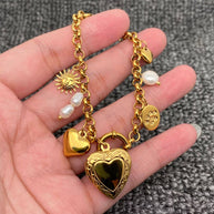 18 GP S.Steel Heart Locket Charm Bracelet